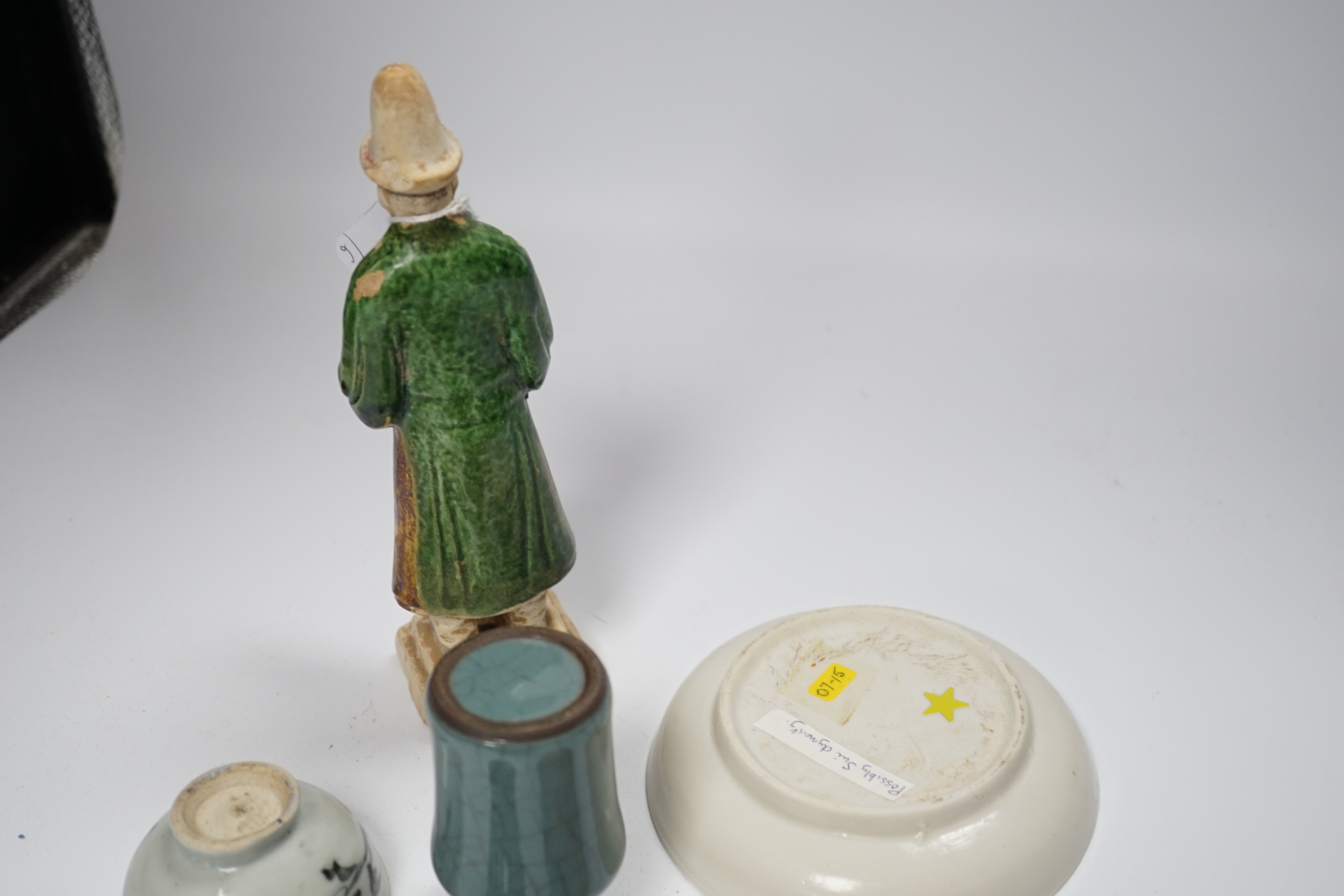 A Chinese Ming sancai figure, a similar cup, a 17th century blanc de chine dish, a blue and white bowl, a small crackle glaze bowl and a carved hardstone snuff bottle (6)